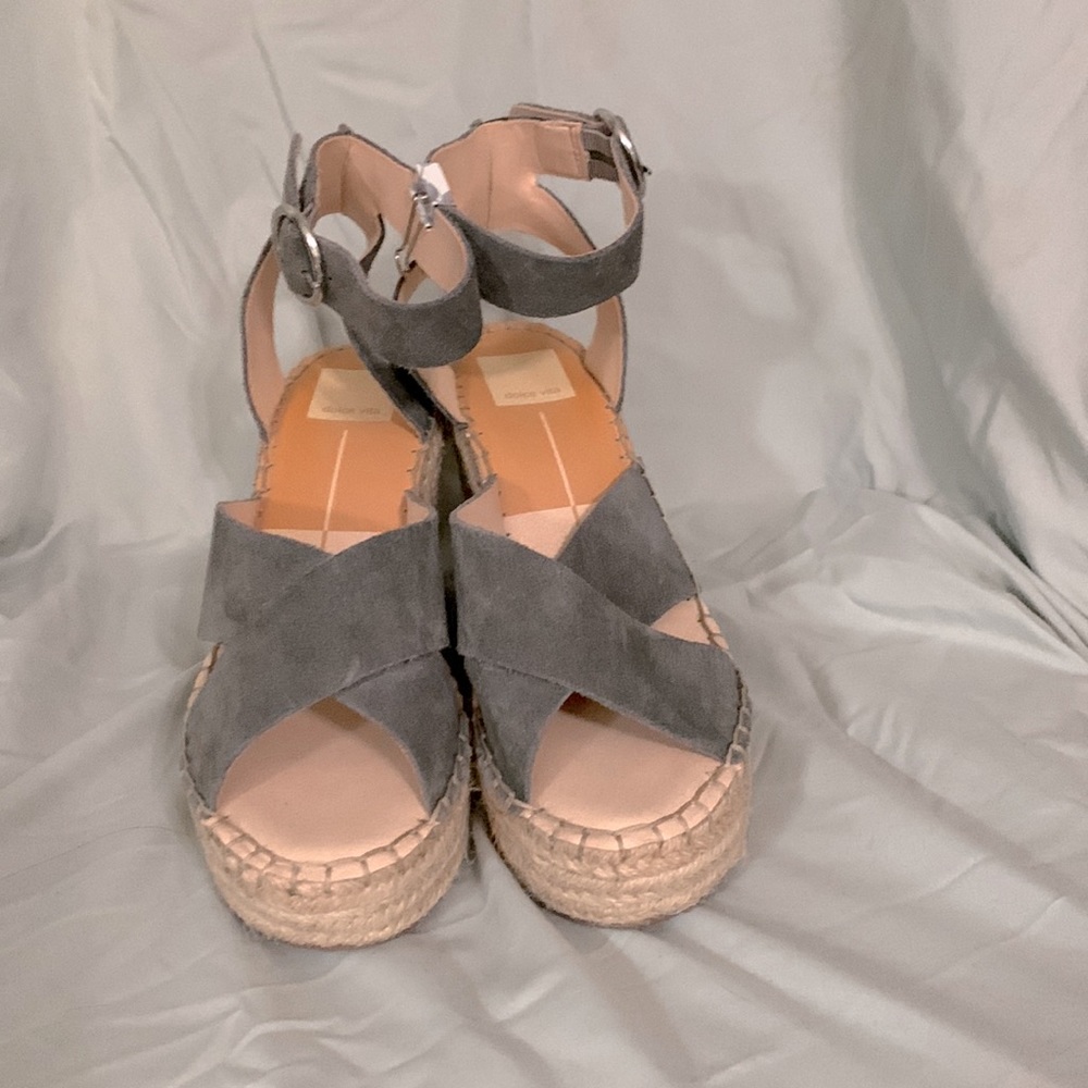 Slip on sandals with ankle strap.